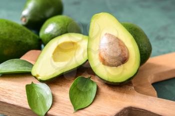 Fresh ripe avocados on wooden boards�