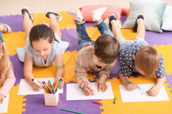 Cute little children drawing in kindergarten�