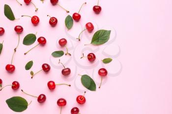 Tasty ripe cherry on color background�