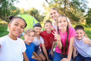 Group of children taking selfie at summer camp�