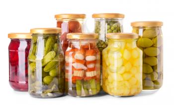 Jars with different canned vegetables and legumes on white background�