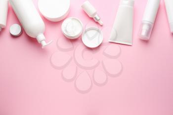 Set of cosmetic products on color background�