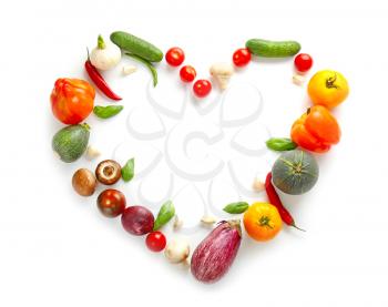 Heart made of different fresh vegetables on white background�