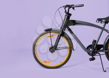 Modern bicycle on color background�