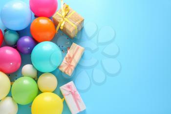 Many balloons and gift boxes on color background�