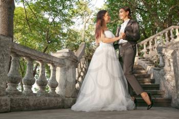 Beautiful lesbian couple on their wedding day outdoors�