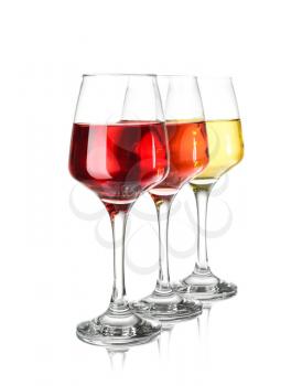 Glasses of different wine on white background�