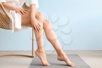 Woman with beautiful legs after depilation at home�