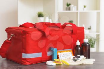 First aid kit on table in clinic�