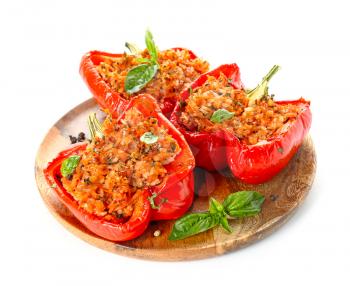 Plate with tasty stuffed pepper on white background�