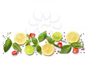 Citrus fruits with different spices on white background�