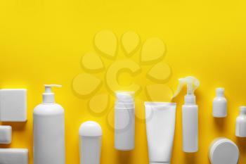 Cosmetics for personal hygiene on color background�