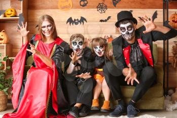 Family celebrating Halloween at home�
