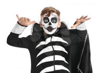 Little boy in Halloween costume on white background�