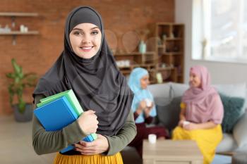 Female Muslim student at home�