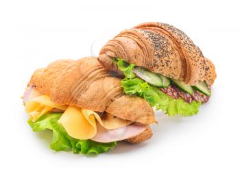 Tasty croissant sandwiches on white background�