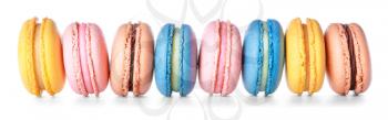 Different tasty macarons on white background�