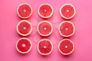 Fresh cut grapefruit on color background�