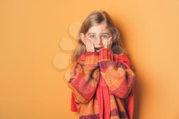 Surprised fashionable girl on color background�