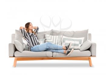Young woman relaxing on sofa against white background�