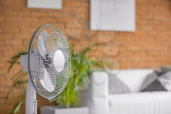 Modern electric fan in room�