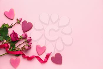 Composition with heart shaped cookies for Valentine's day on color background�
