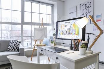 Comfortable workplace of interior designer in office�