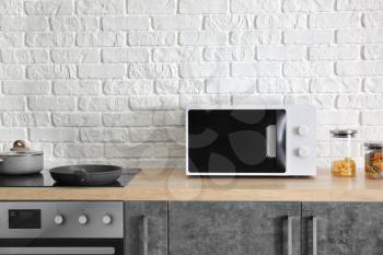 Modern microwave oven in kitchen�