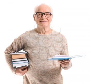 Portrait of elderly man reading books on white background�