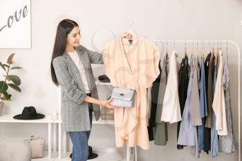 Young female clothes stylist at workplace�
