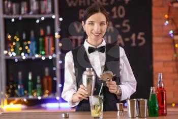 Beautiful female bartender in pub�