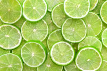 Fresh lime slices as background�