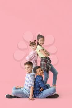 Cute little dancers on color background�