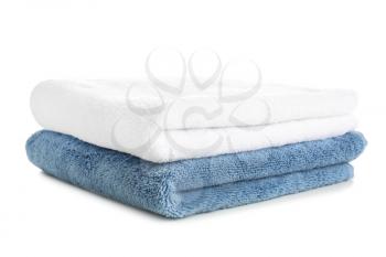 Stack of clean soft towels on white background�