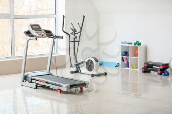 Interior of gym with modern equipment�
