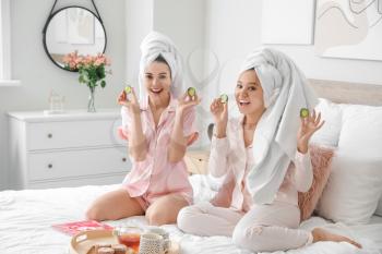 Beautiful young women taking care of their skin at home�