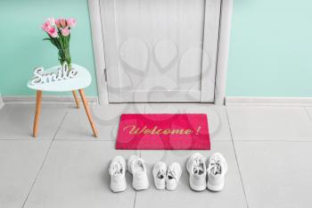 Interior of modern stylish hallway with door mat�