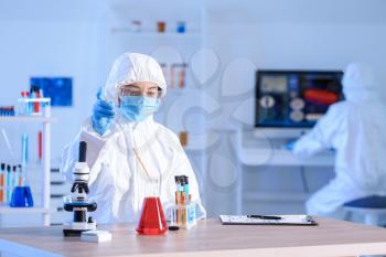 Scientist working with sample in laboratory�