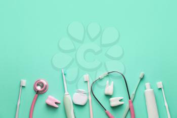 Set for oral hygiene with stethoscope on color background�