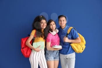 Young students on color background�