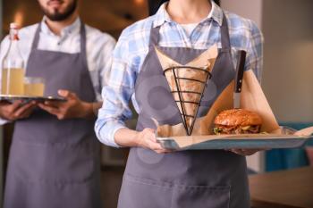 Young waiters in restaurant, closeup�