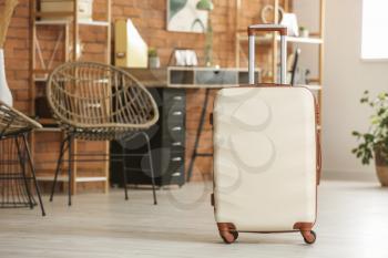 Packed suitcase at home. Travel concept�