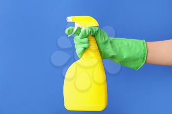 Hand with detergent on color background�
