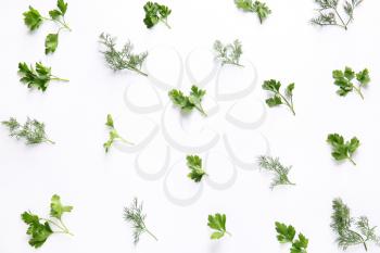 Fresh parsley and dill on white background�