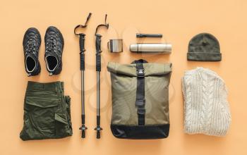 Equipment for hiking on color background�