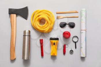 Set of items for hiking on light background�