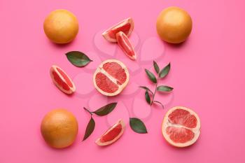 Fresh cut grapefruits on color background�