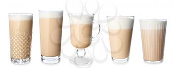 Glasses of tasty latte coffee on white background�