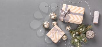 Composition with beautiful Christmas gift boxes on grey background with space for text�