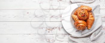 Sweet pastry on white wooden background with space for text�